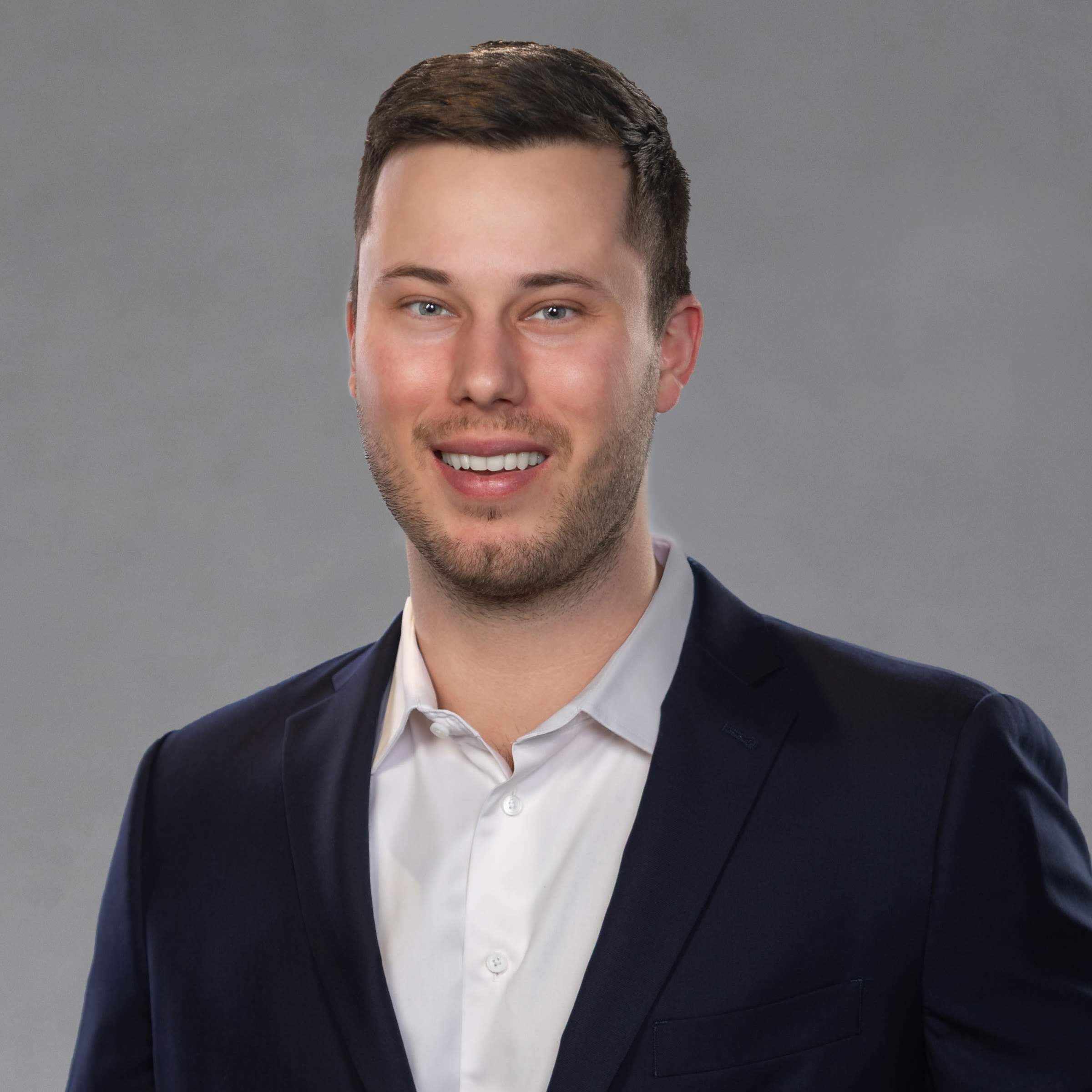 Smiling man in navy suit portrait
