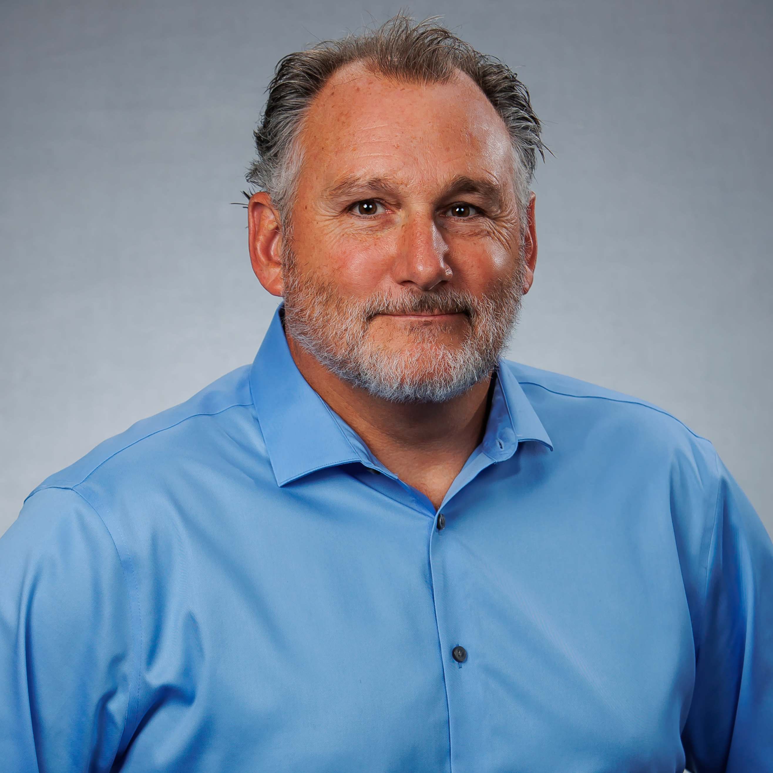 Middle-aged man in blue shirt portrait