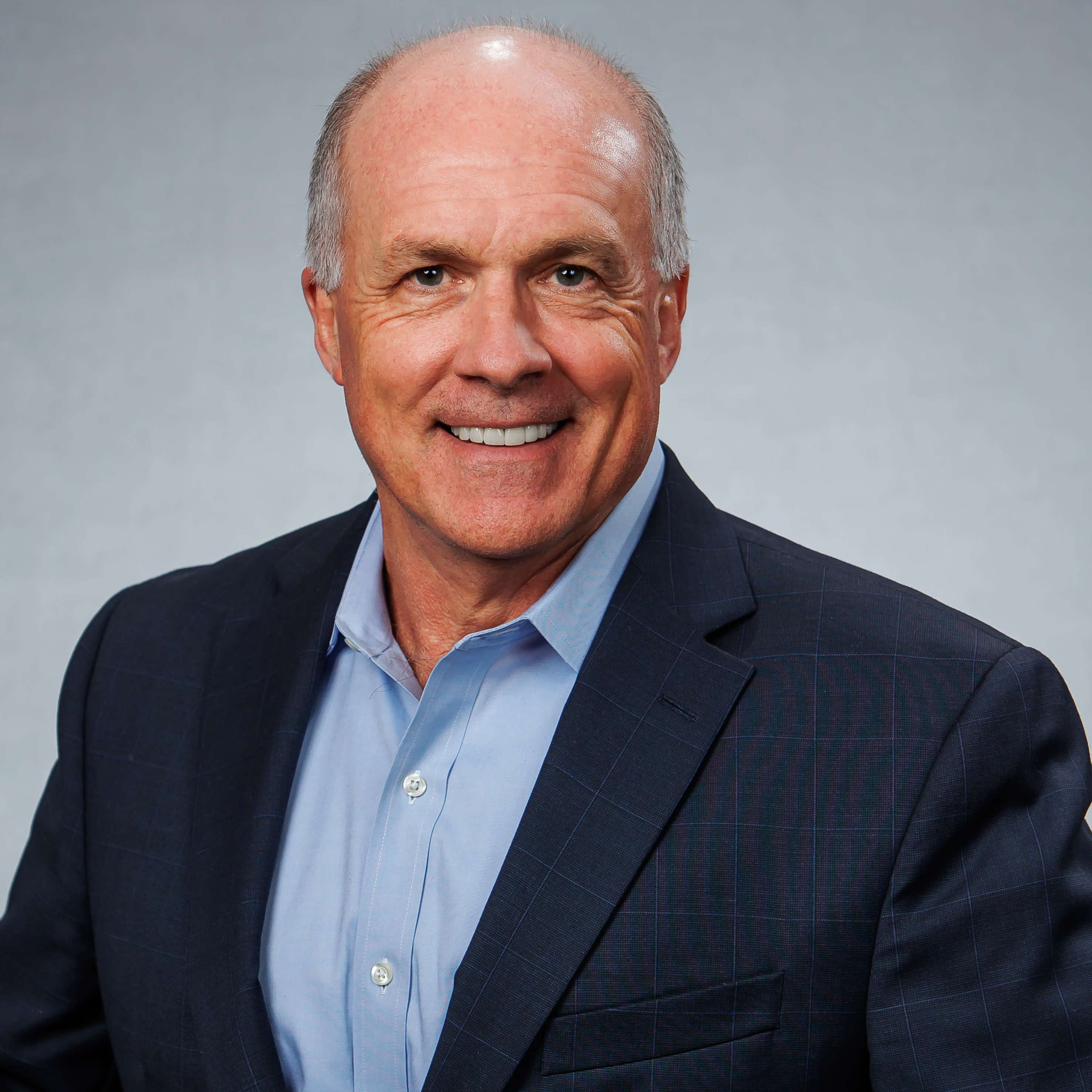 Smiling middle-aged man in business suit portrait