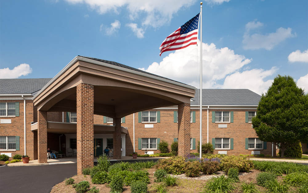 Brick building with American flag and covered entrance