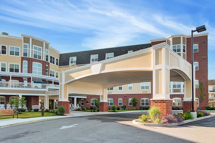 Large apartment building with covered entrance driveway